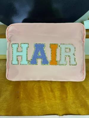HAIR Xl Nylon Varsity Pouch - Pink with Multi Colored Patch Gold Lettering
