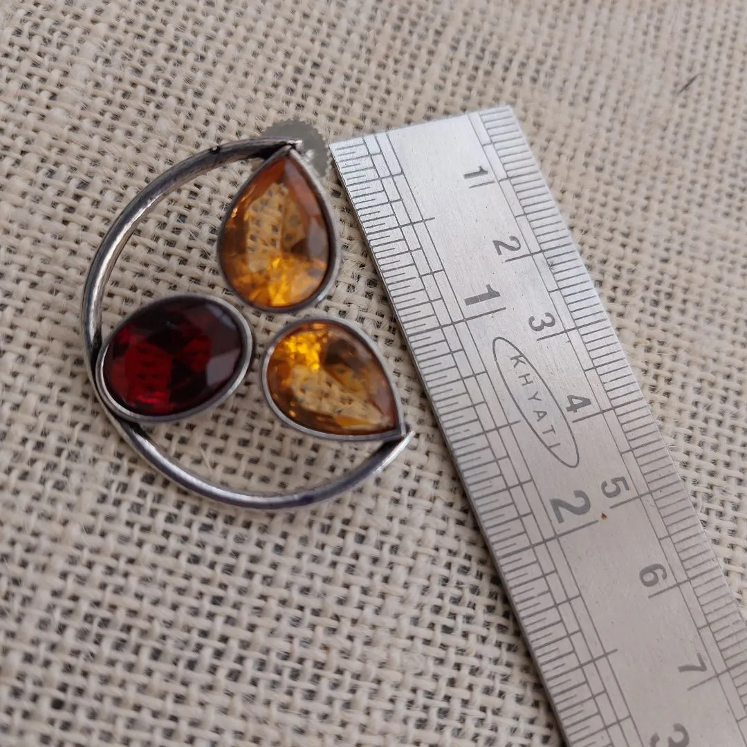 Sunset Symphony: Silver-Toned Ear Studs with Yellow and Red Stone"