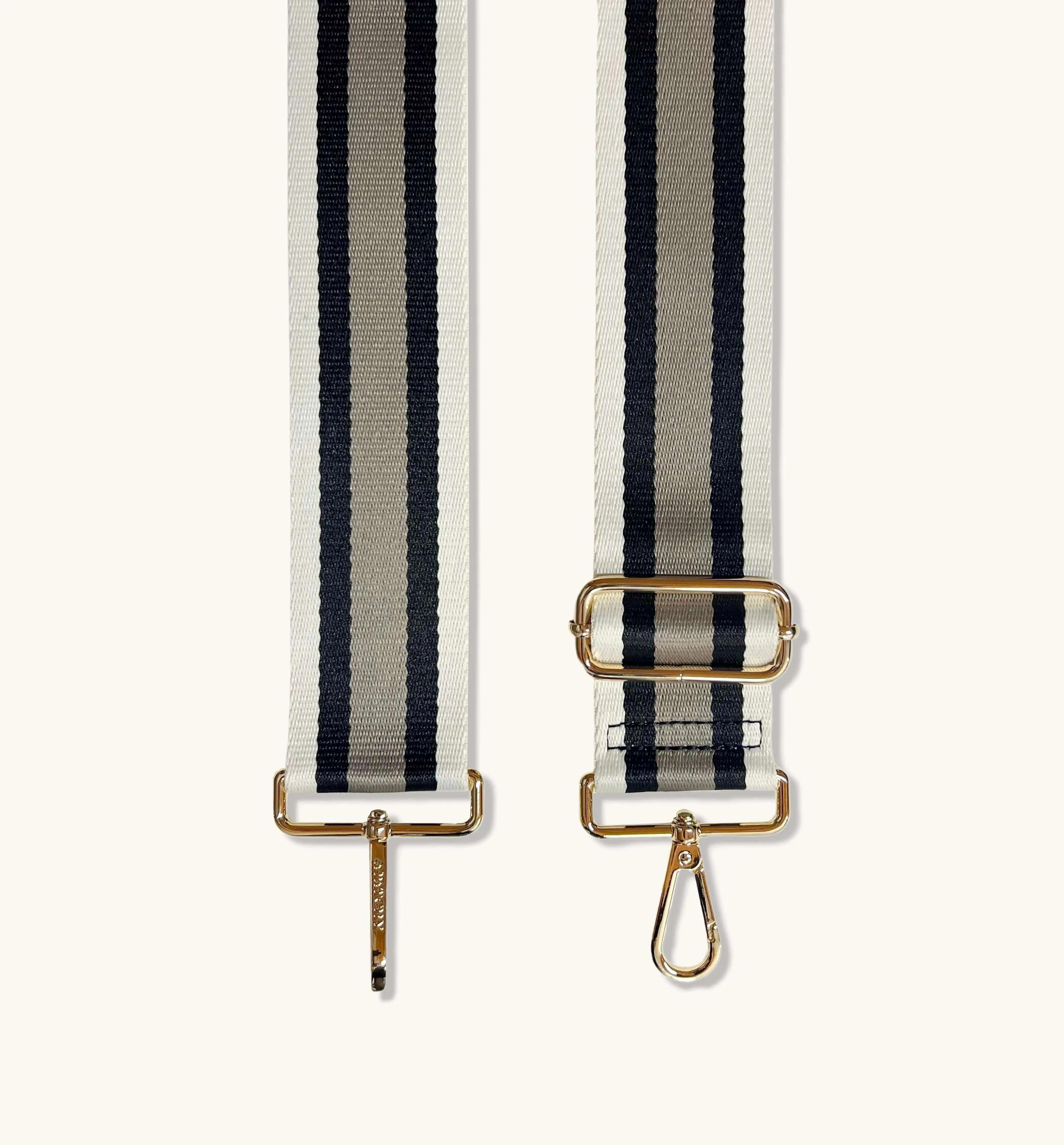 The Tassel Black Leather Crossbody Bag With Latte Stripe Strap