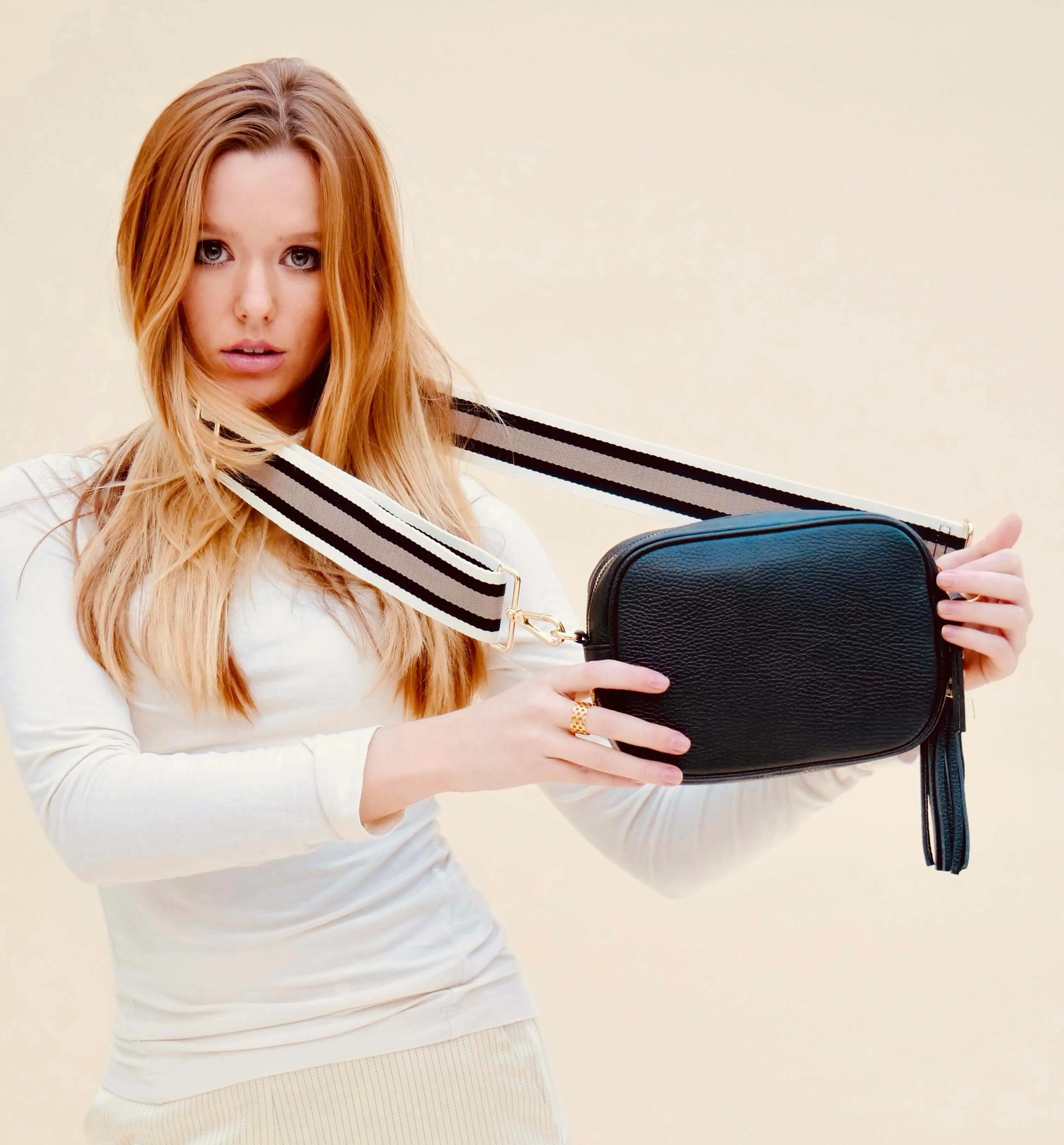 The Tassel Black Leather Crossbody Bag With Latte Stripe Strap