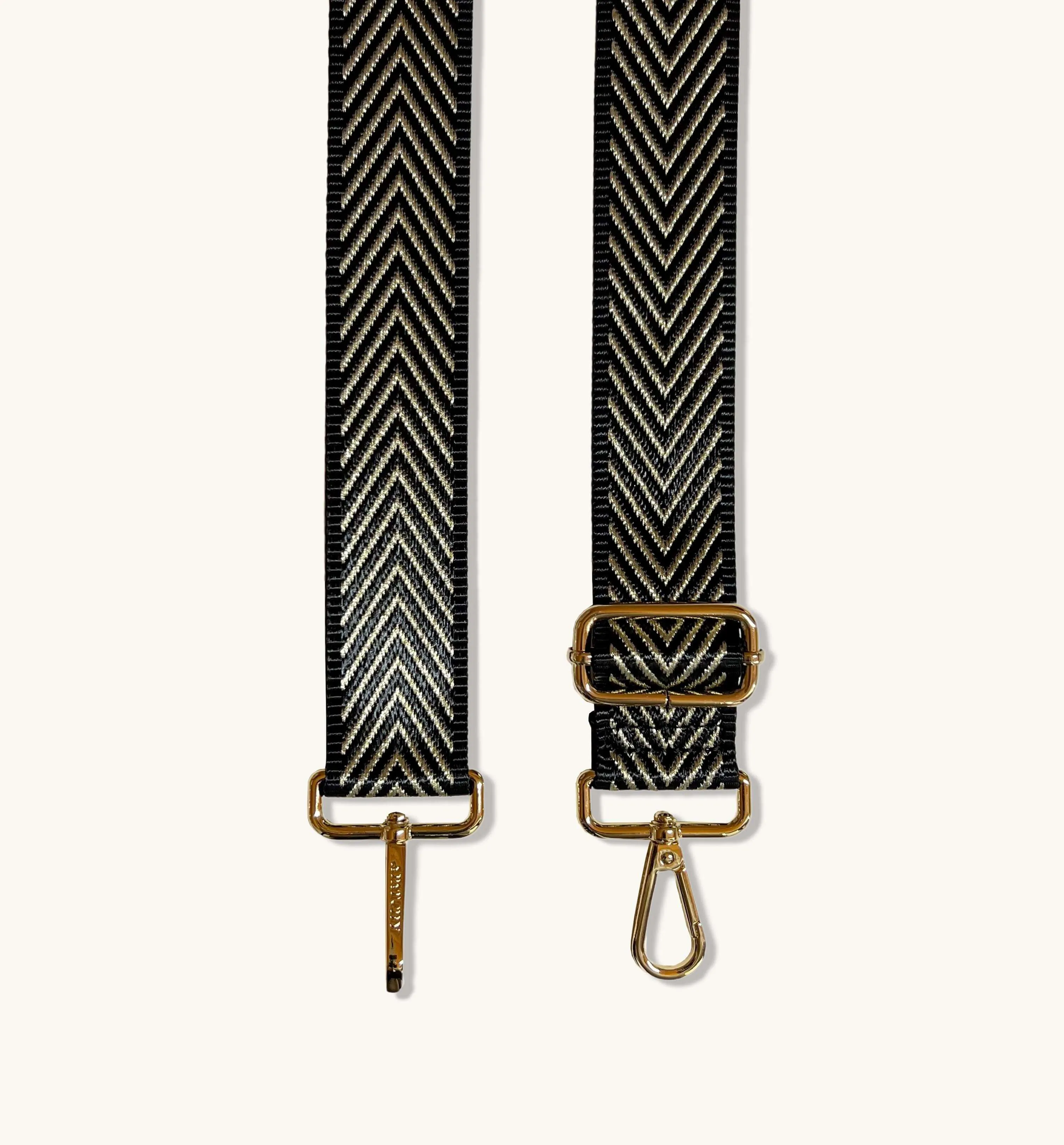 The Tassel Bronze Leather Crossbody Bag With Black & Gold Chevron Strap