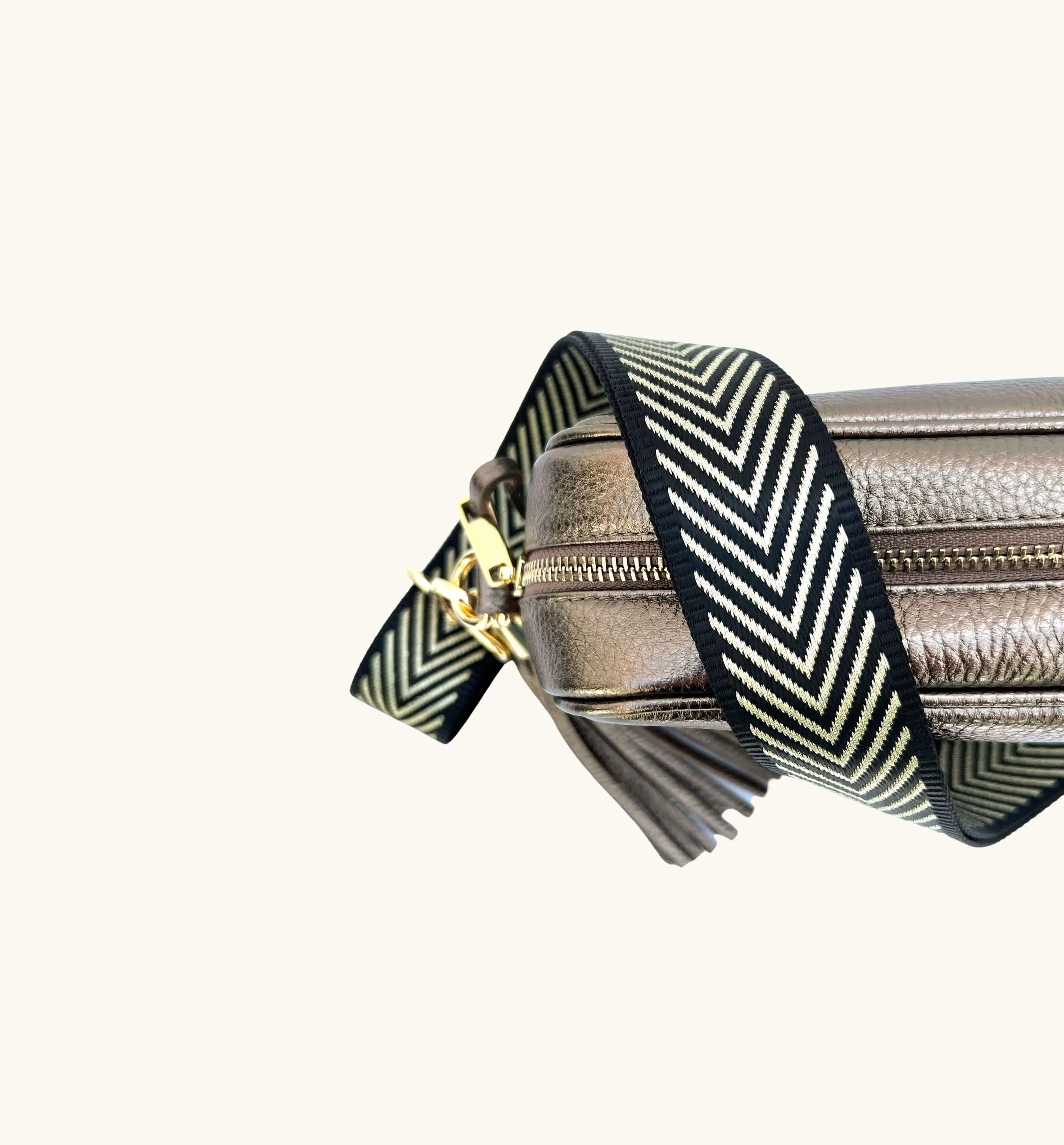 The Tassel Bronze Leather Crossbody Bag With Black & Gold Chevron Strap